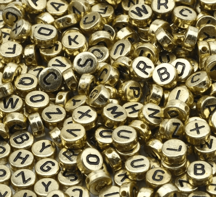 Miçangas Redonda Alfabeto Dourado 10 Gramas