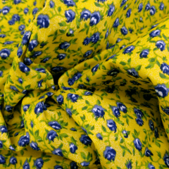 Tecido Tricoline Amarelo Florzinhas Azuis 
